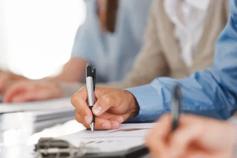 person filling out a survey