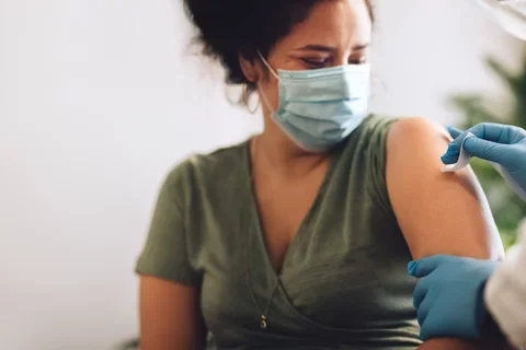 woman recieving a vaccine