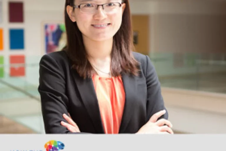 Headshot of Hengchen Dai with a caption including the How the World Works Podcast logo and her name.