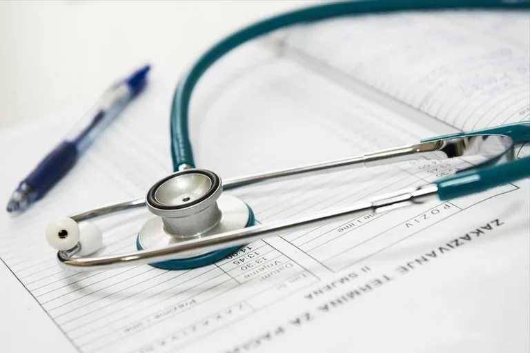 stethoscope and medical paperwork