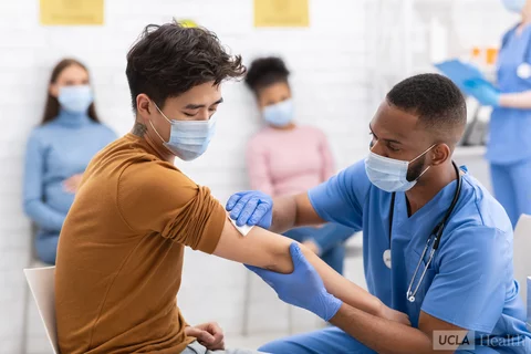 man being given a vaccine